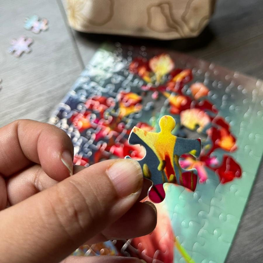 puzzle 120 pièces bec rose oiseau de La Réunion sur branche de flamboyants